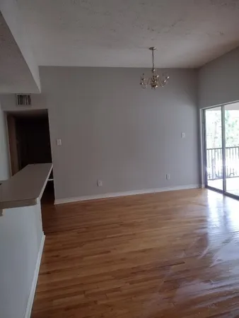 a view of a livingroom with wooden floor