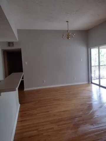 a view of a livingroom with wooden floor