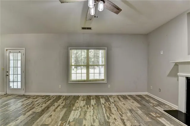 a view of an empty room with a window