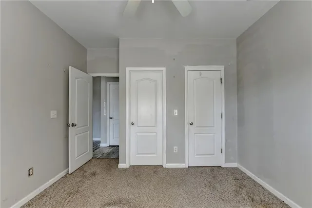 a bathroom with a double vanity sink a mirror and a shower