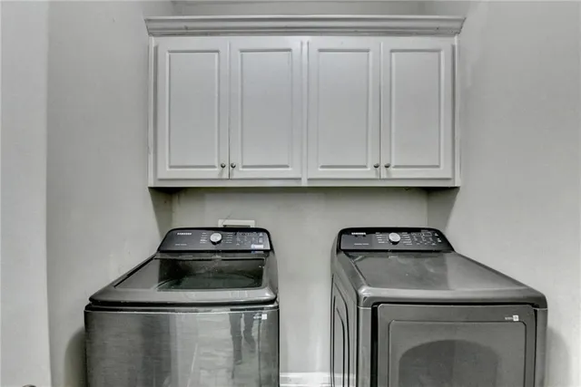 a bathroom with a sink a light fixture and a mirror