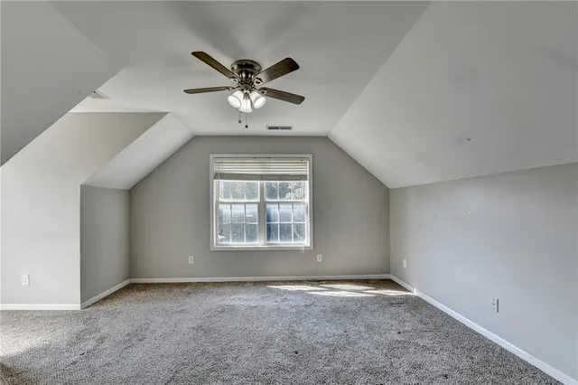 a view of outdoor space with green field and trees