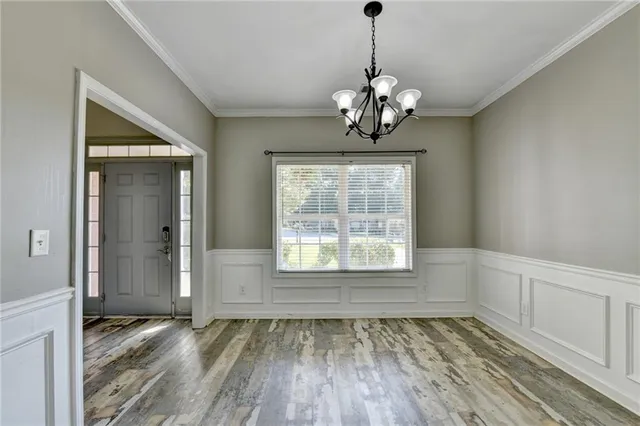 a view of kitchen with stainless steel appliances granite countertop refrigerator sink and stove
