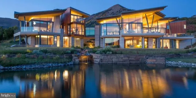 a front view of a house with a lake view