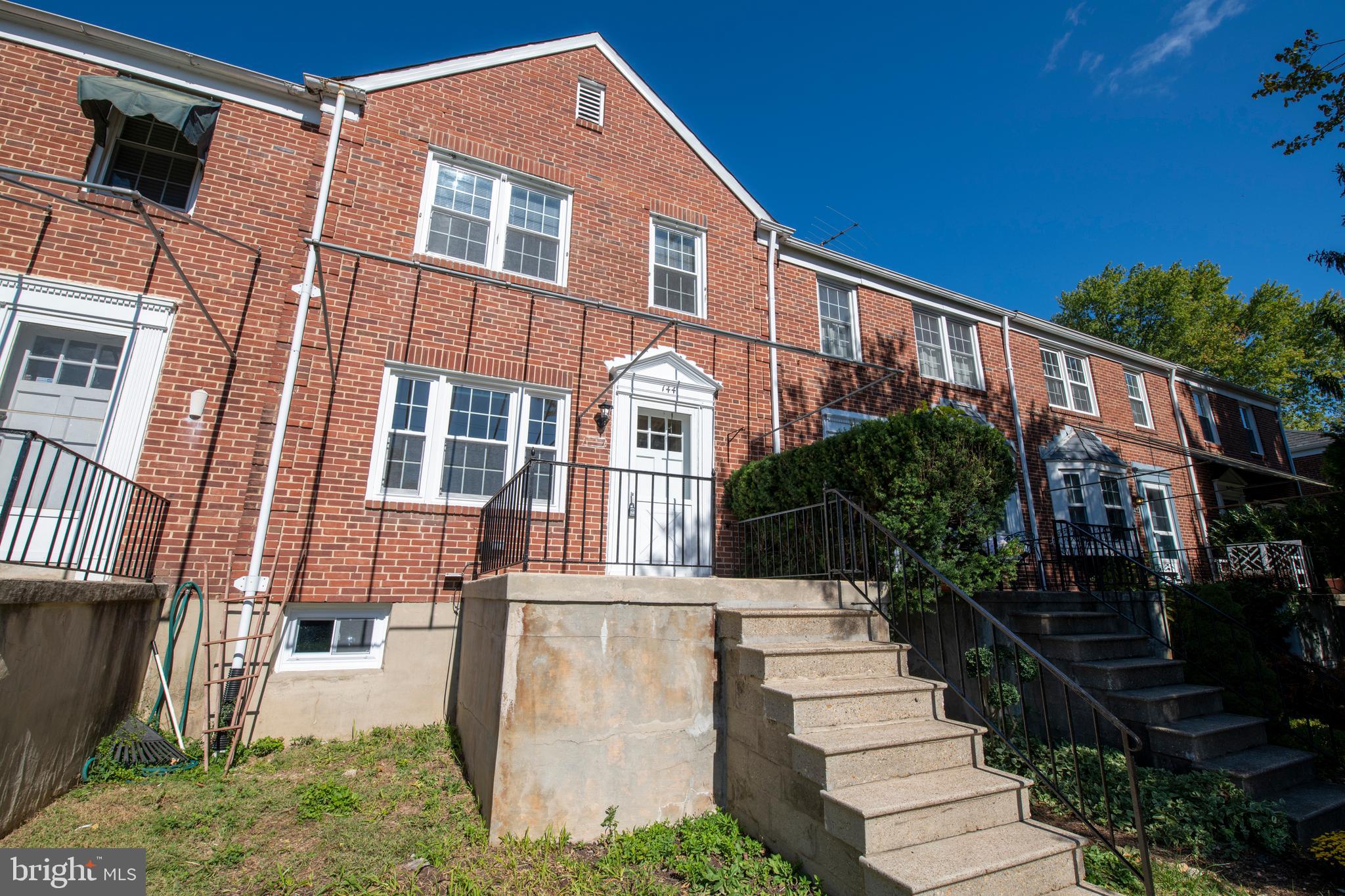 144 Dumbarton Road Baltimore, MD 21212 - Photo 3 of 46 a front view of a house with a yard