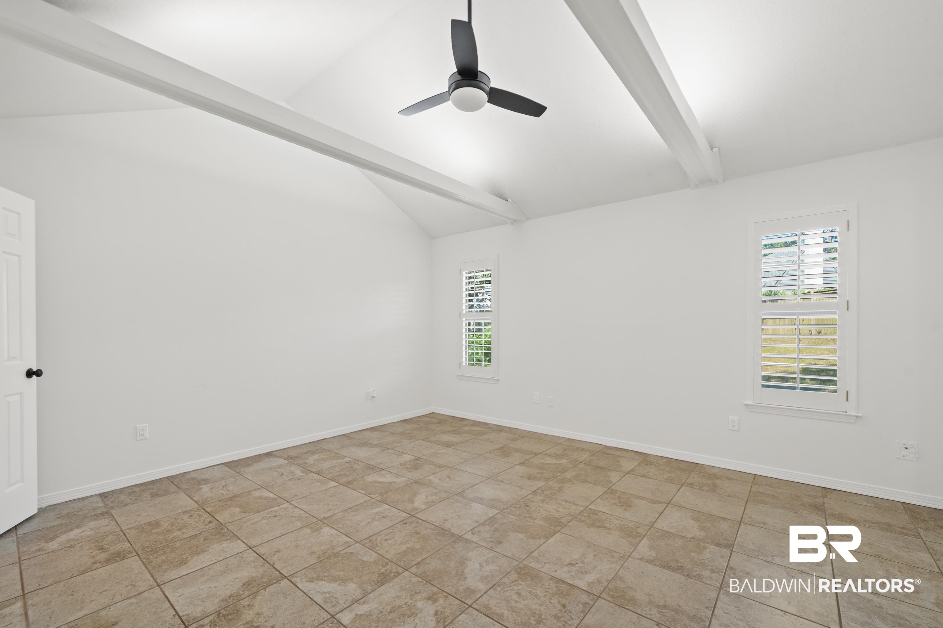 306 Liberty Street Fairhope, AL 36532 - Photo 16 of 32 Featuring vaulted ceiling and exposed beams.