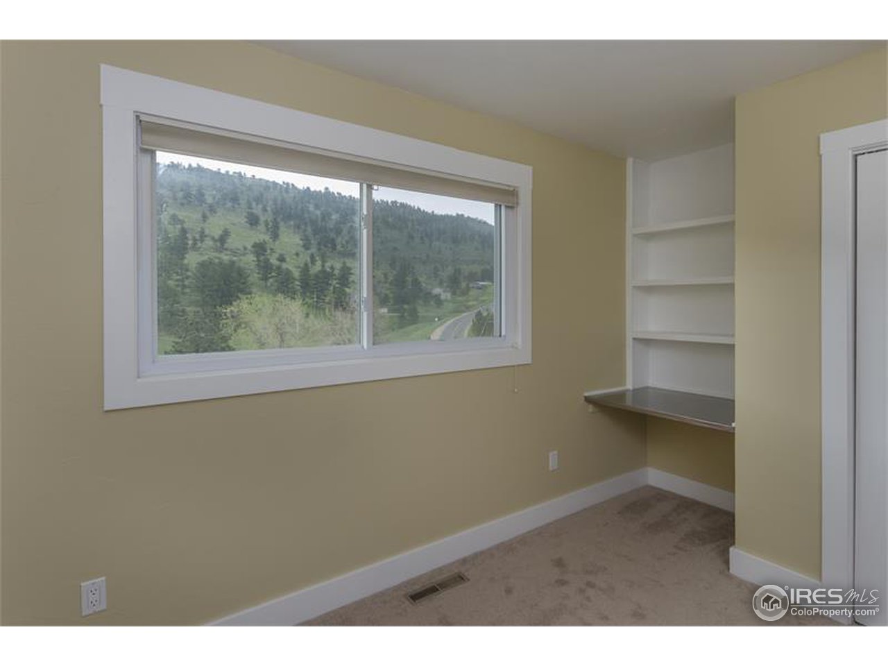 6909 Olde Stage Road Boulder, CO 80302 - Photo 11 of 23 a view of an empty room with a window