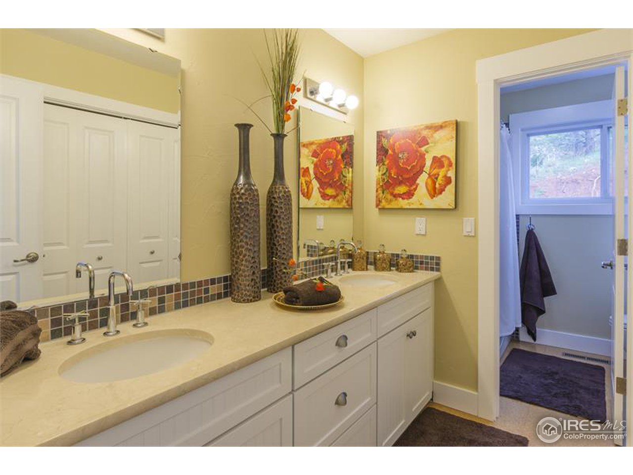 6909 Olde Stage Road Boulder, CO 80302 - Photo 12 of 23 a bathroom with a double vanity sink mirror and double
