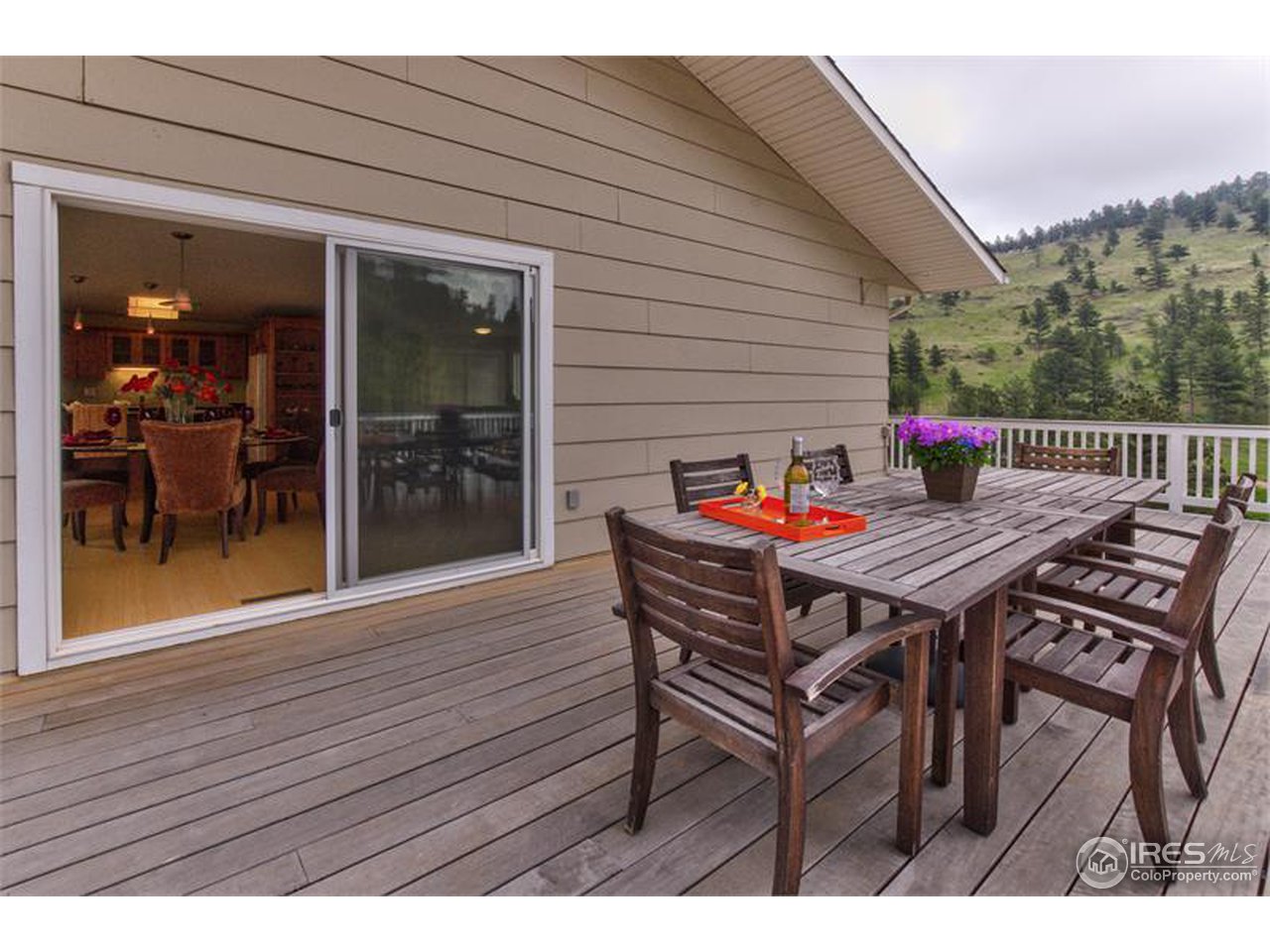 6909 Olde Stage Road Boulder, CO 80302 - Photo 19 of 23 a terrace with outdoor seating and wooden floor