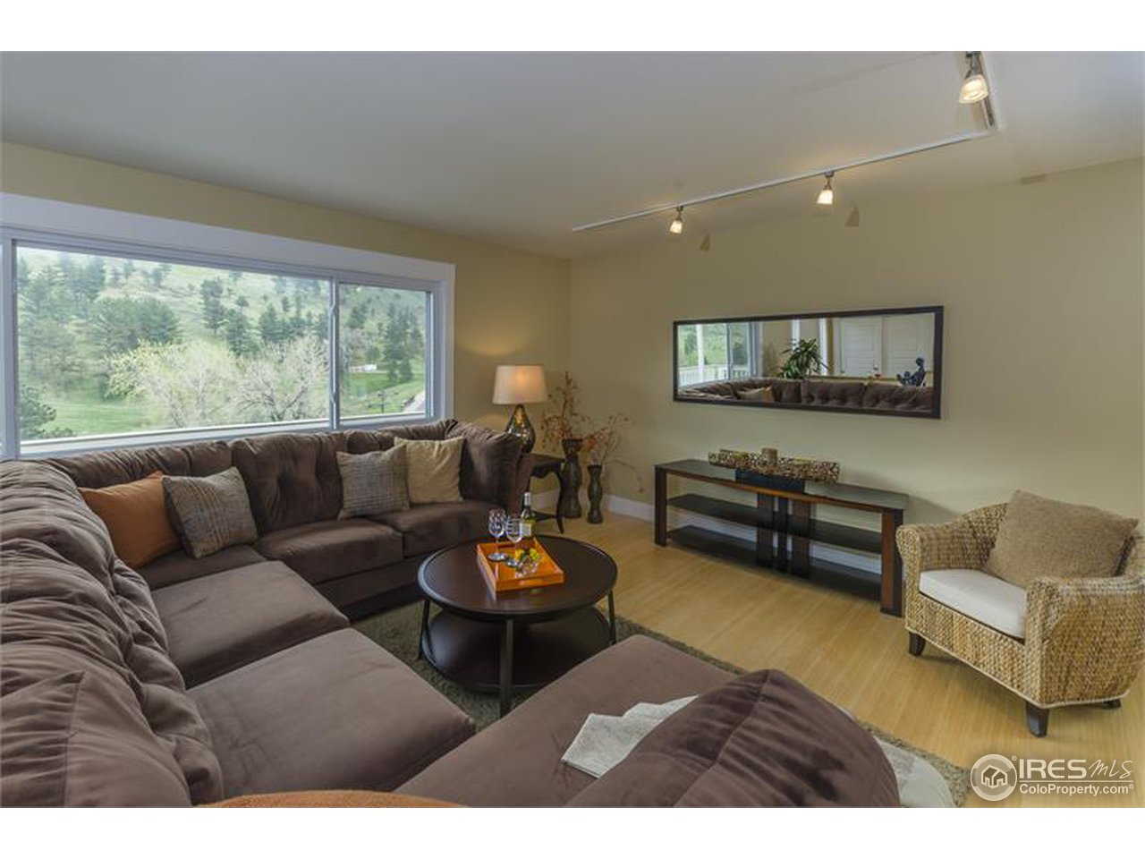 6909 Olde Stage Road Boulder, CO 80302 - Photo 1 of 23 a living room with furniture a rug and a large window