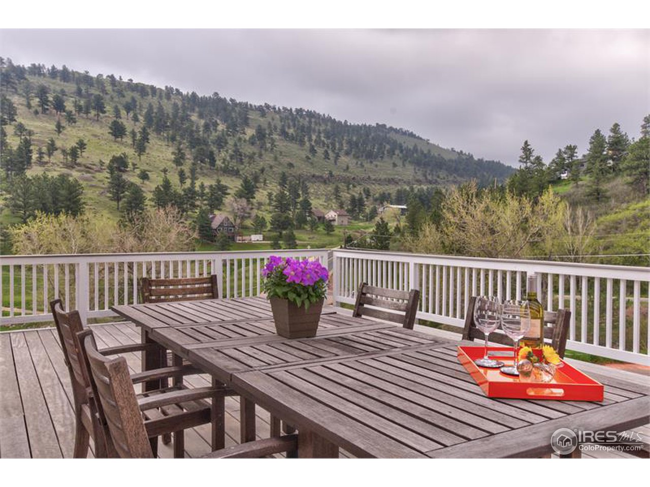6909 Olde Stage Road Boulder, CO 80302 - Photo 20 of 23 a balcony with filled with furniture and wooden floor