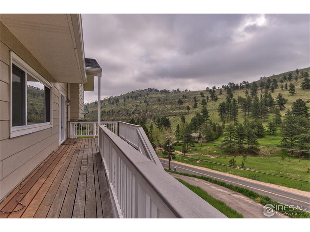 6909 Olde Stage Road Boulder, CO 80302 - Photo 22 of 23 a view of balcony with wooden floor and city view