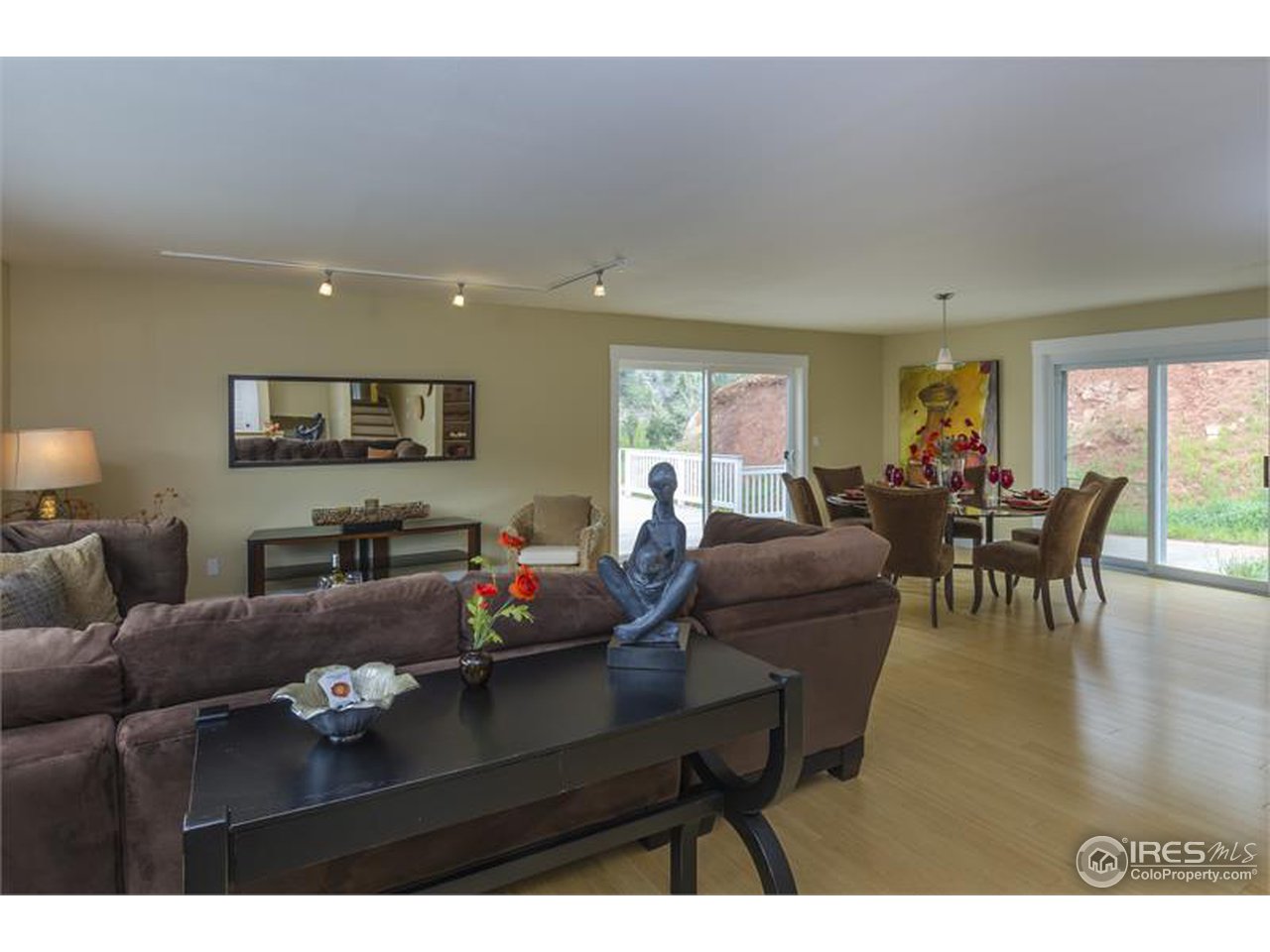6909 Olde Stage Road Boulder, CO 80302 - Photo 2 of 23 a living room with furniture and a flat screen tv