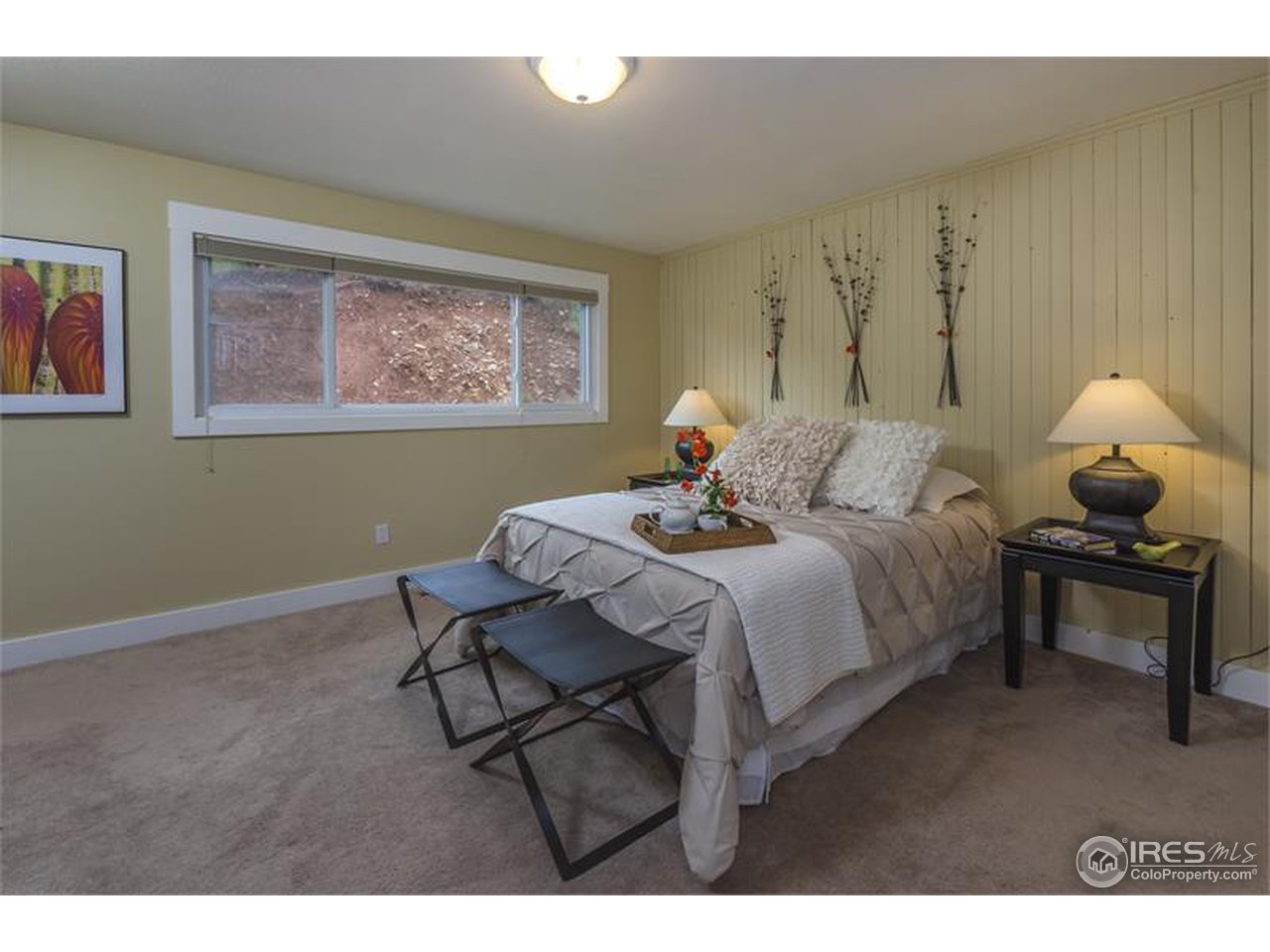 6909 Olde Stage Road Boulder, CO 80302 - Photo 7 of 23 a bedroom with a bed and window