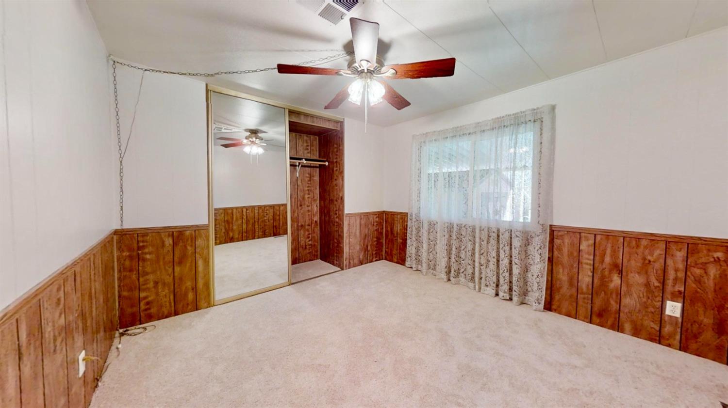 156 Rimma Way Roseville, CA 95661 - Photo 15 of 24 a bedroom with a large bed and ceiling fan