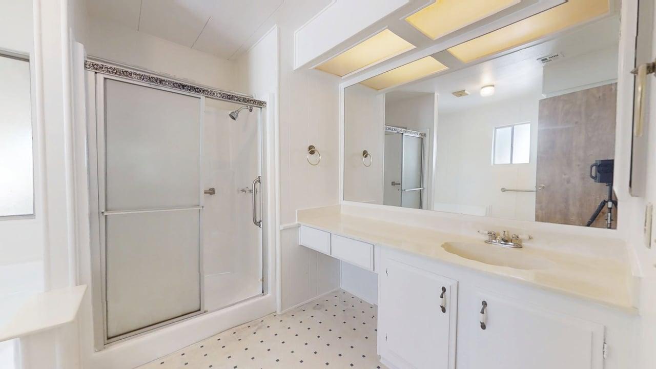 156 Rimma Way Roseville, CA 95661 - Photo 16 of 24 a bathroom with a shower sink and mirror