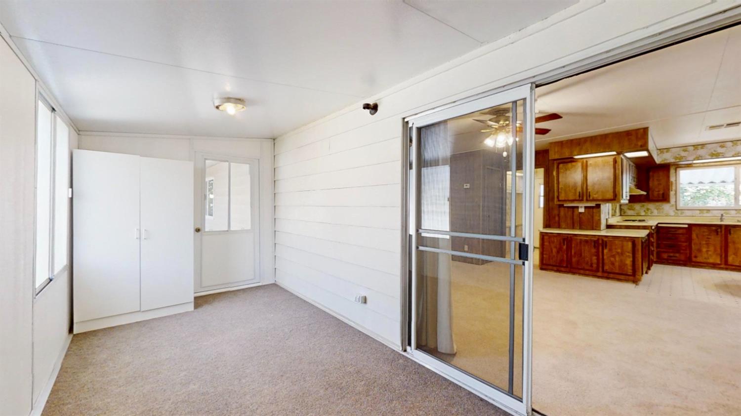 156 Rimma Way Roseville, CA 95661 - Photo 19 of 24 a view of kitchen with refrigerator and wooden floor