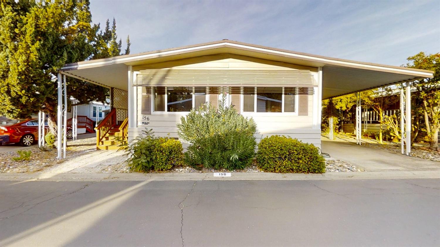 156 Rimma Way Roseville, CA 95661 - Photo 21 of 24 front view of a house with a garden