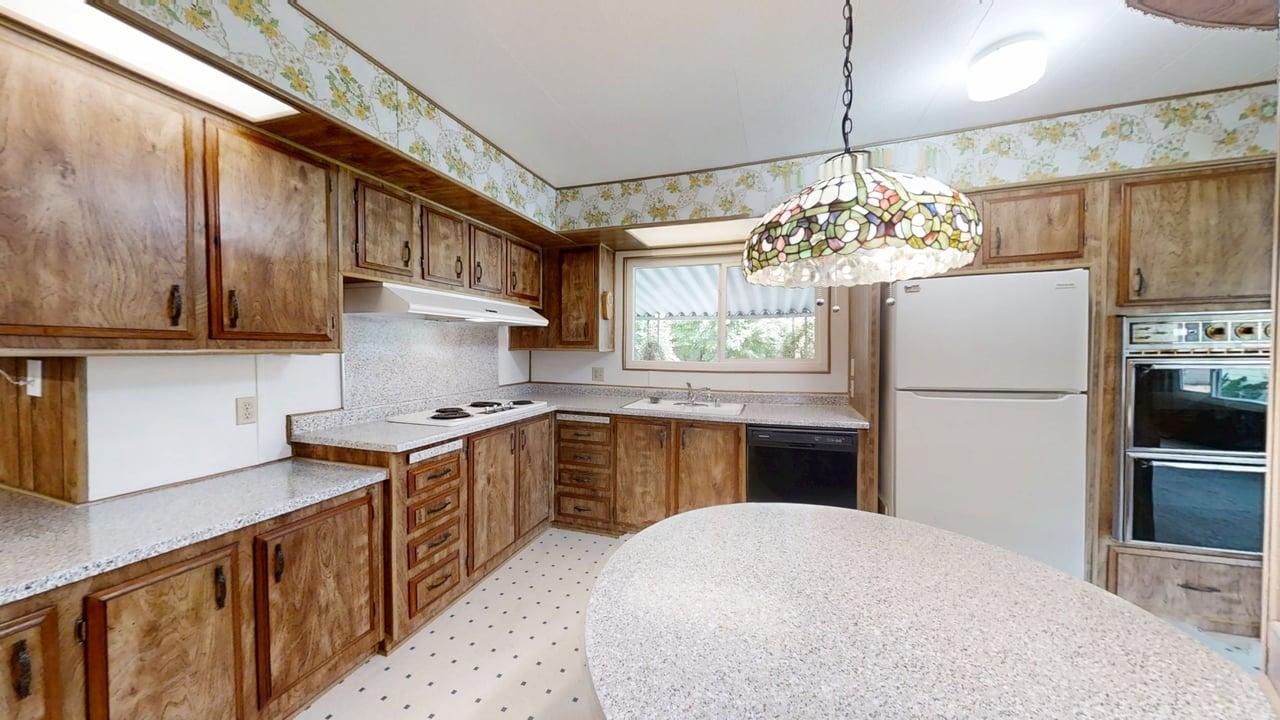 156 Rimma Way Roseville, CA 95661 - Photo 8 of 24 a kitchen with granite countertop a refrigerator stove top oven and sink