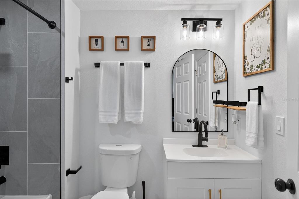 1503 Granite State Court Mount Dora, FL 32757 - Photo 53 of 77 a bathroom with a sink and a mirror