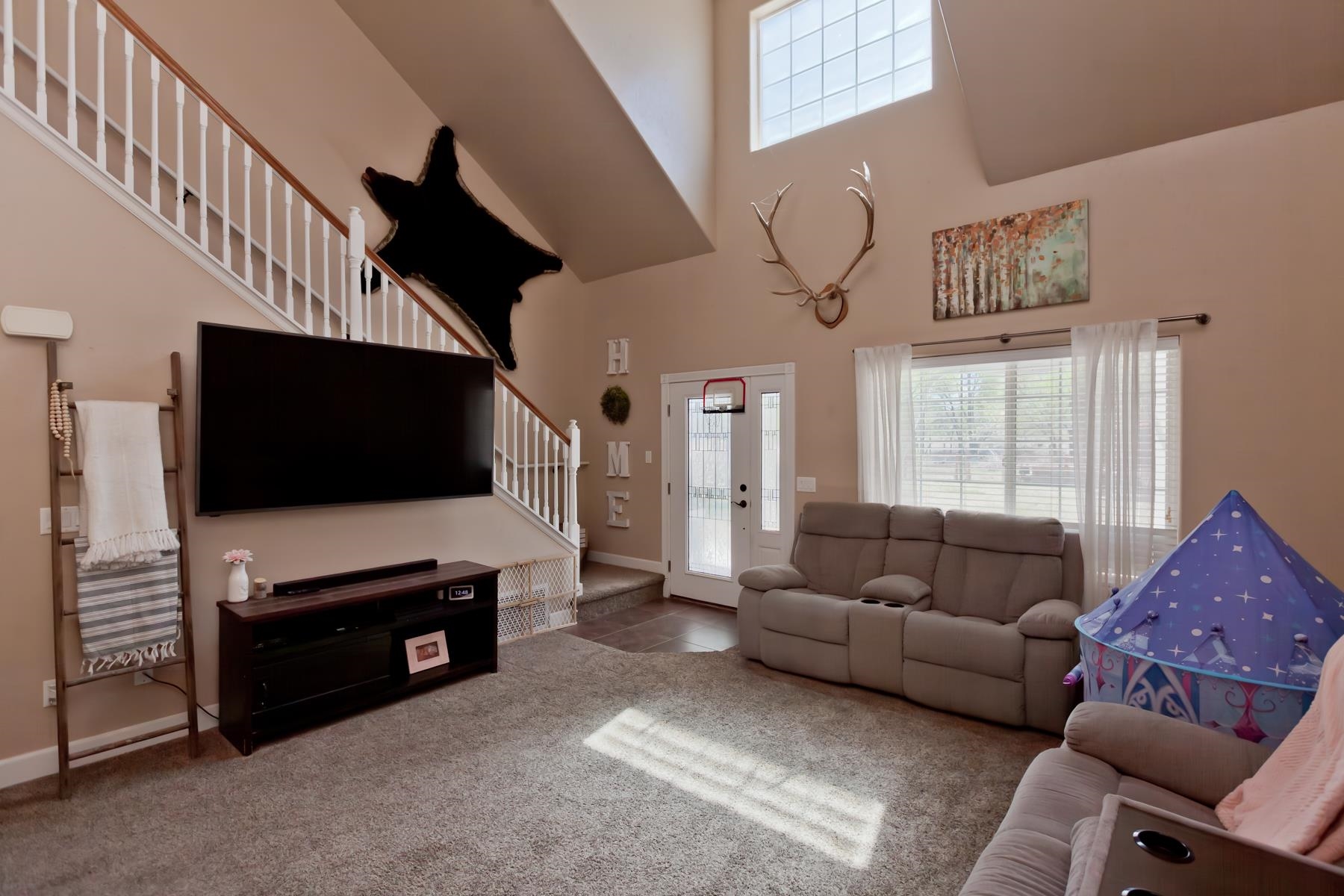 2314 Broadway Grand Junction, CO 81507 - Photo 12 of 39 a living room with furniture and a flat screen tv