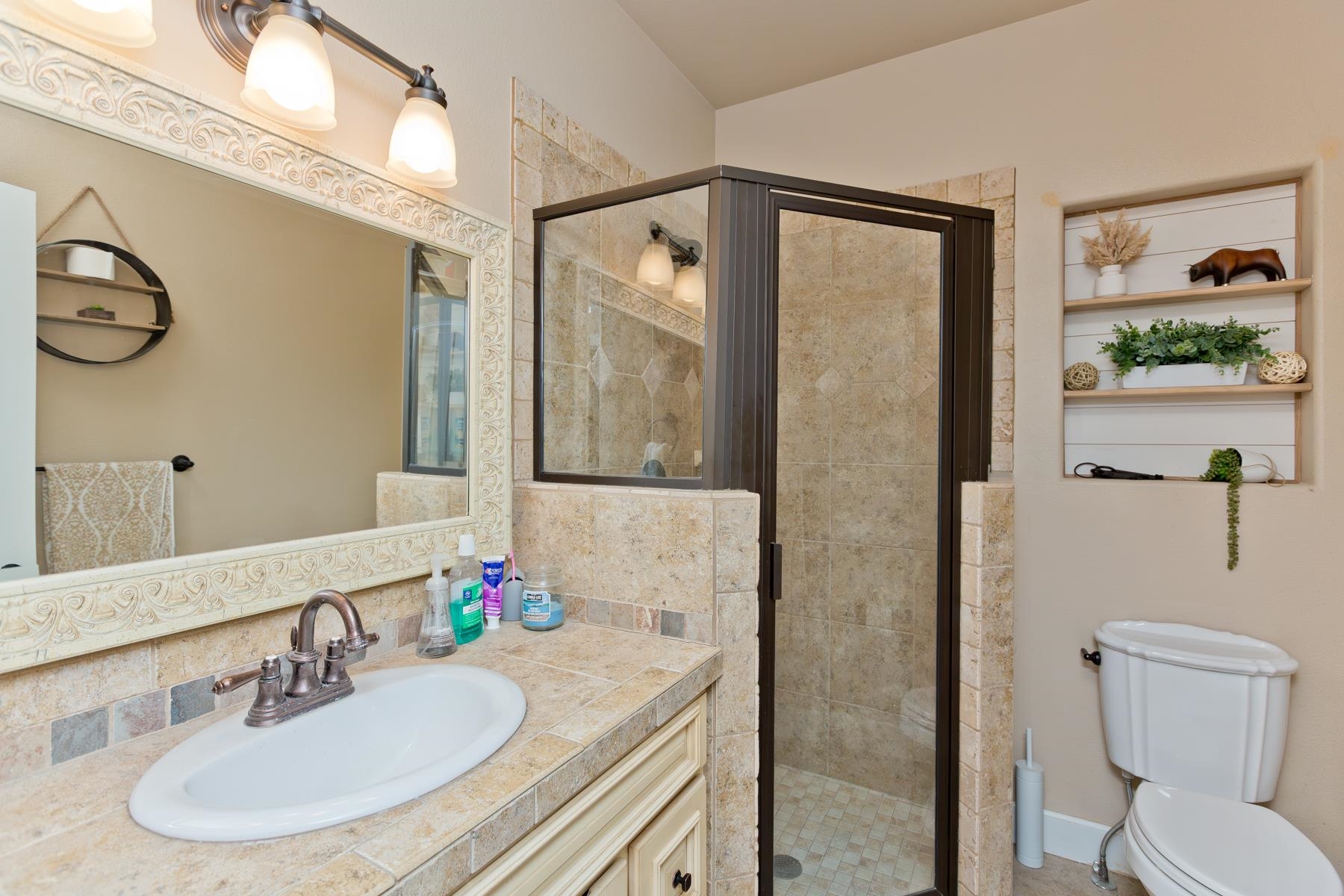 2314 Broadway Grand Junction, CO 81507 - Photo 16 of 39 a bathroom with a granite countertop sink and a mirror