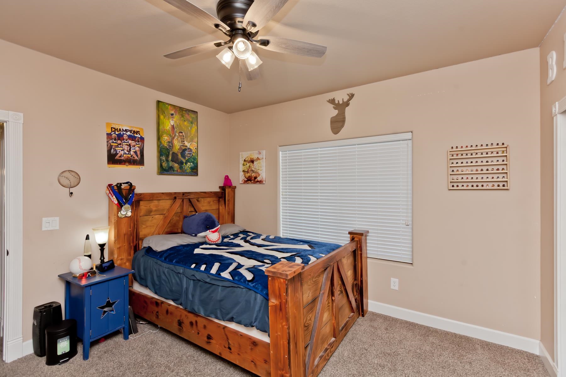 2314 Broadway Grand Junction, CO 81507 - Photo 18 of 39 a bedroom with a bed and a chandelier