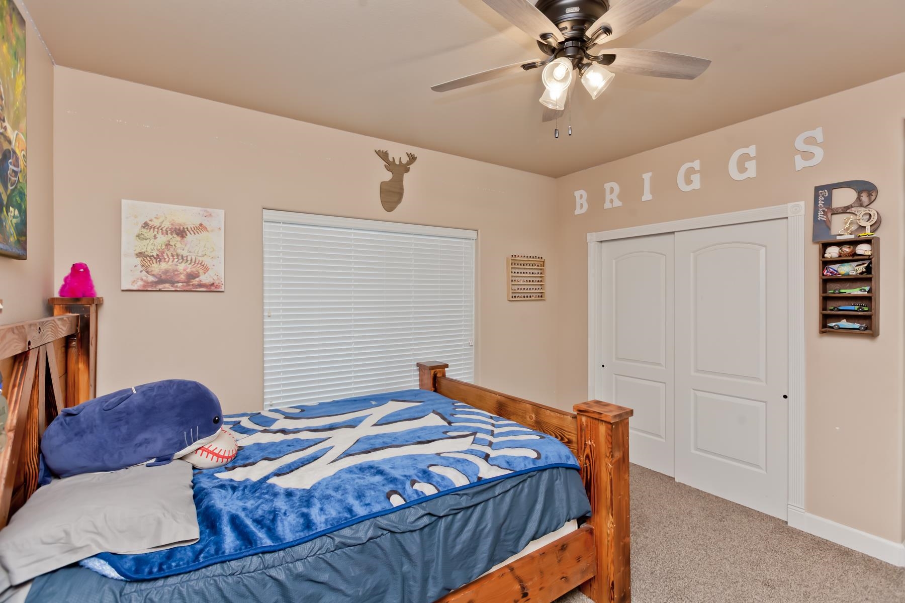 2314 Broadway Grand Junction, CO 81507 - Photo 19 of 39 a bedroom with a bed and a chandelier