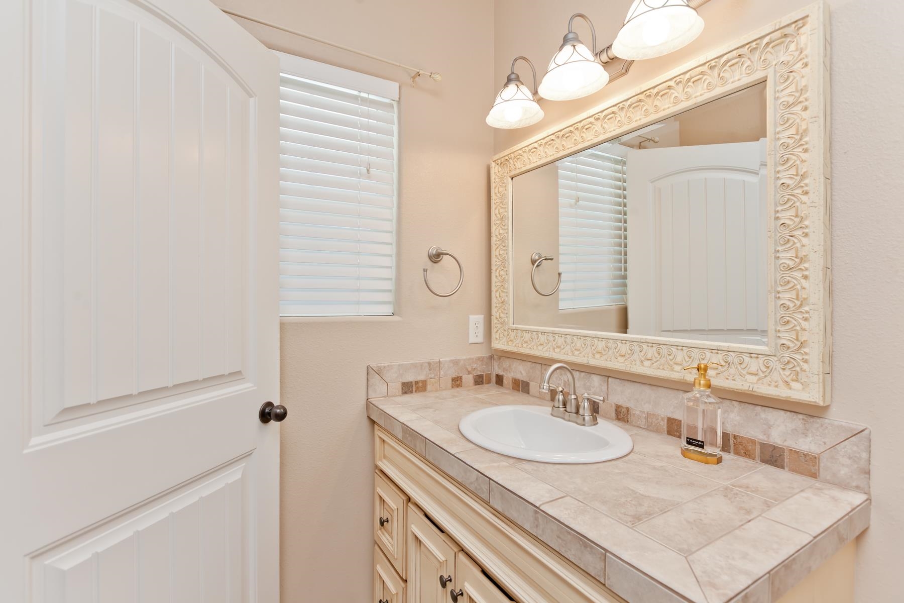 2314 Broadway Grand Junction, CO 81507 - Photo 24 of 39 a bathroom with a sink and a mirror
