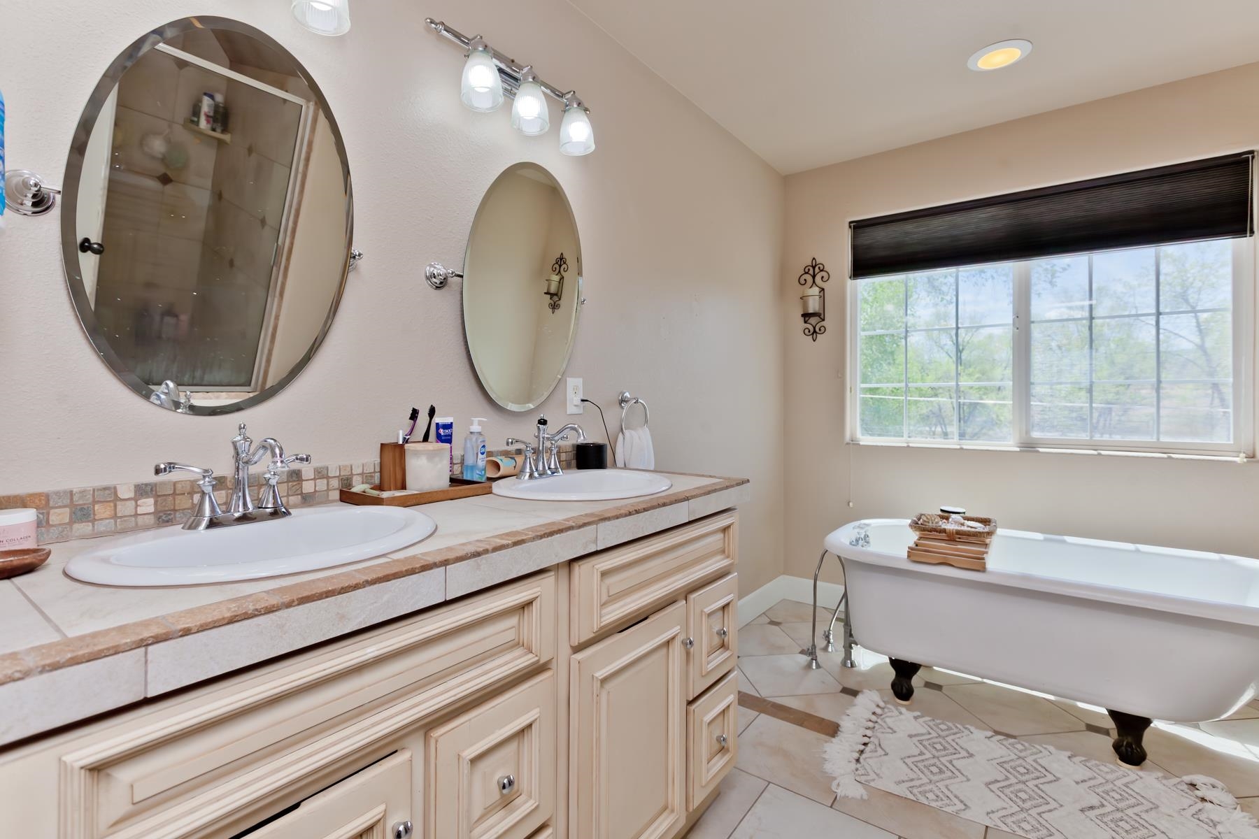 2314 Broadway Grand Junction, CO 81507 - Photo 28 of 39 a bathroom with a double vanity sink and a mirror