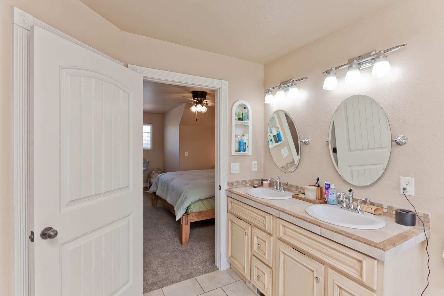 2314 Broadway Grand Junction, CO 81507 - Photo 30 of 39 a en suite bathroom with a double vanity sink and a mirror