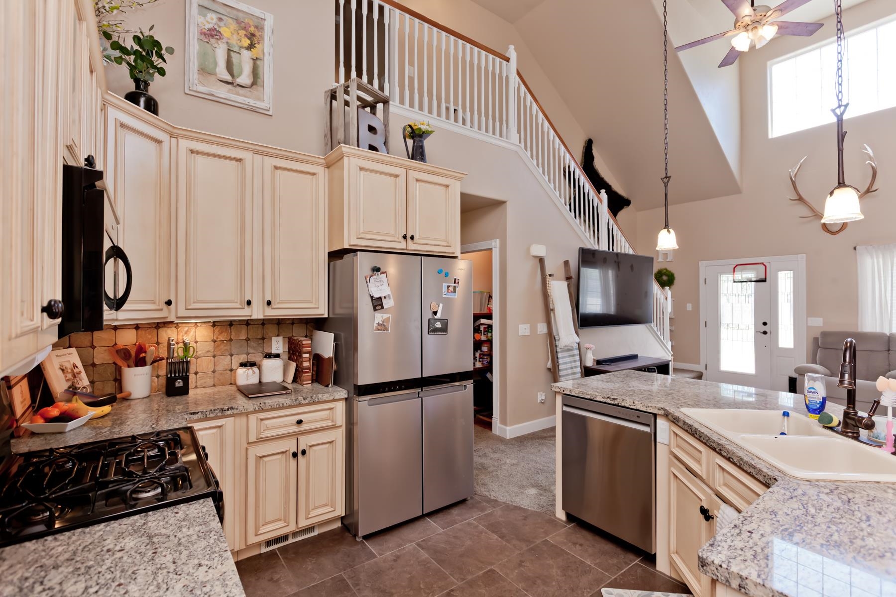 2314 Broadway Grand Junction, CO 81507 - Photo 3 of 39 a kitchen with refrigerator cabinets and stove top oven