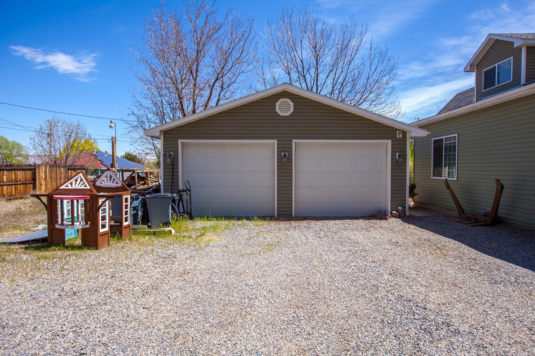 2314 Broadway Grand Junction, CO 81507 - Photo 31 of 39 a backyard of a house with barbeque oven table and chairs