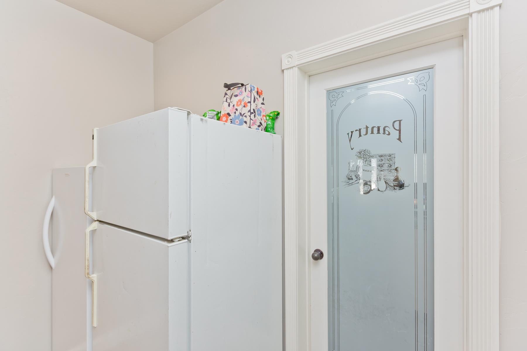 2314 Broadway Grand Junction, CO 81507 - Photo 9 of 39 a white refrigerator freezer sitting inside of a kitchen