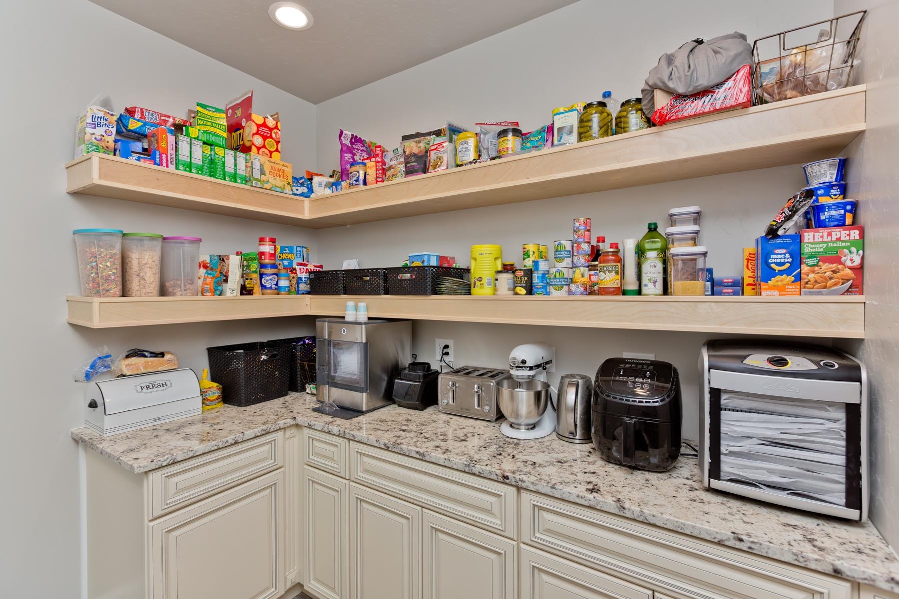 2314 Broadway Grand Junction, CO 81507 - Photo 10 of 39 a kitchen with a refrigerator and a white wooden cabinets
