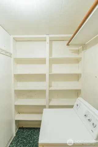 a view of storage and utility room with washer and dryer