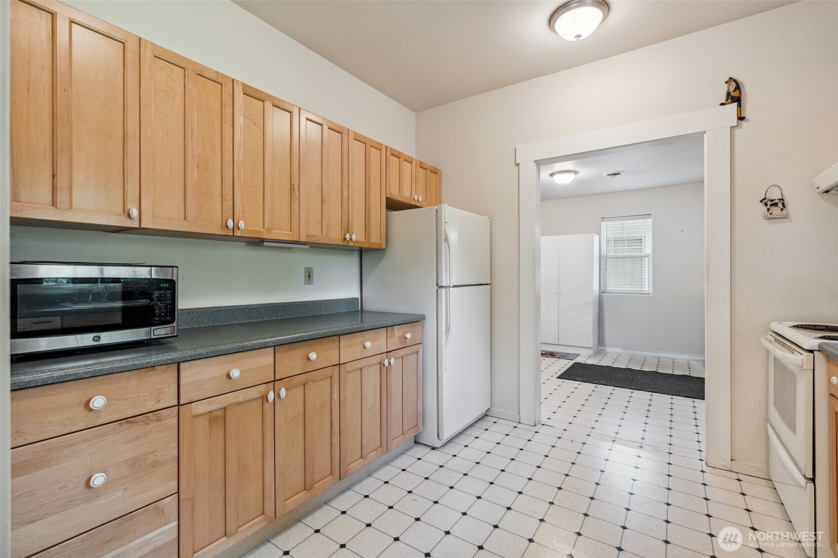 3381 Centralia Alpha Road Onalaska, WA 98570 - Photo 11 of 30 a kitchen with granite countertop white cabinets and stainless steel appliances