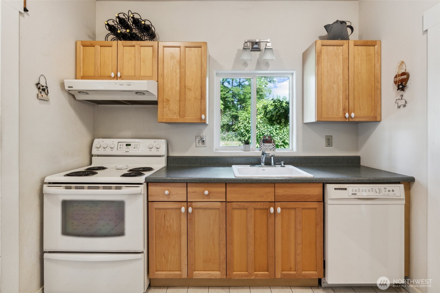 3381 Centralia Alpha Road Onalaska, WA 98570 - Photo 12 of 30 a kitchen with a stove and a sink