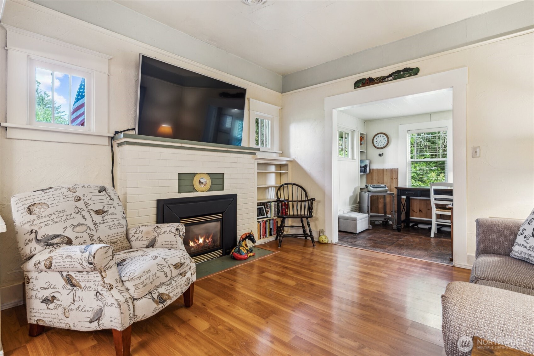3381 Centralia Alpha Road Onalaska, WA 98570 - Photo 7 of 30 a living room with furniture a fireplace and a flat screen tv
