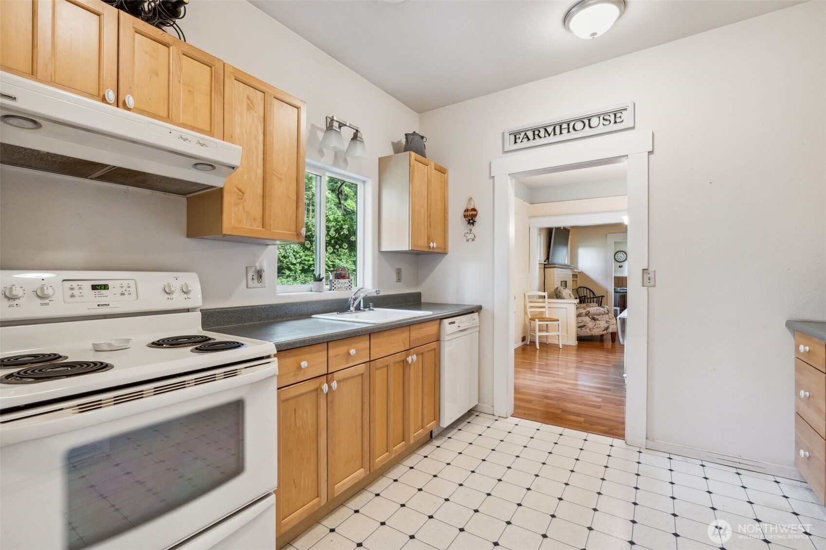 3381 Centralia Alpha Road Onalaska, WA 98570 - Photo 10 of 30 a kitchen with granite countertop a stove a sink and a microwave