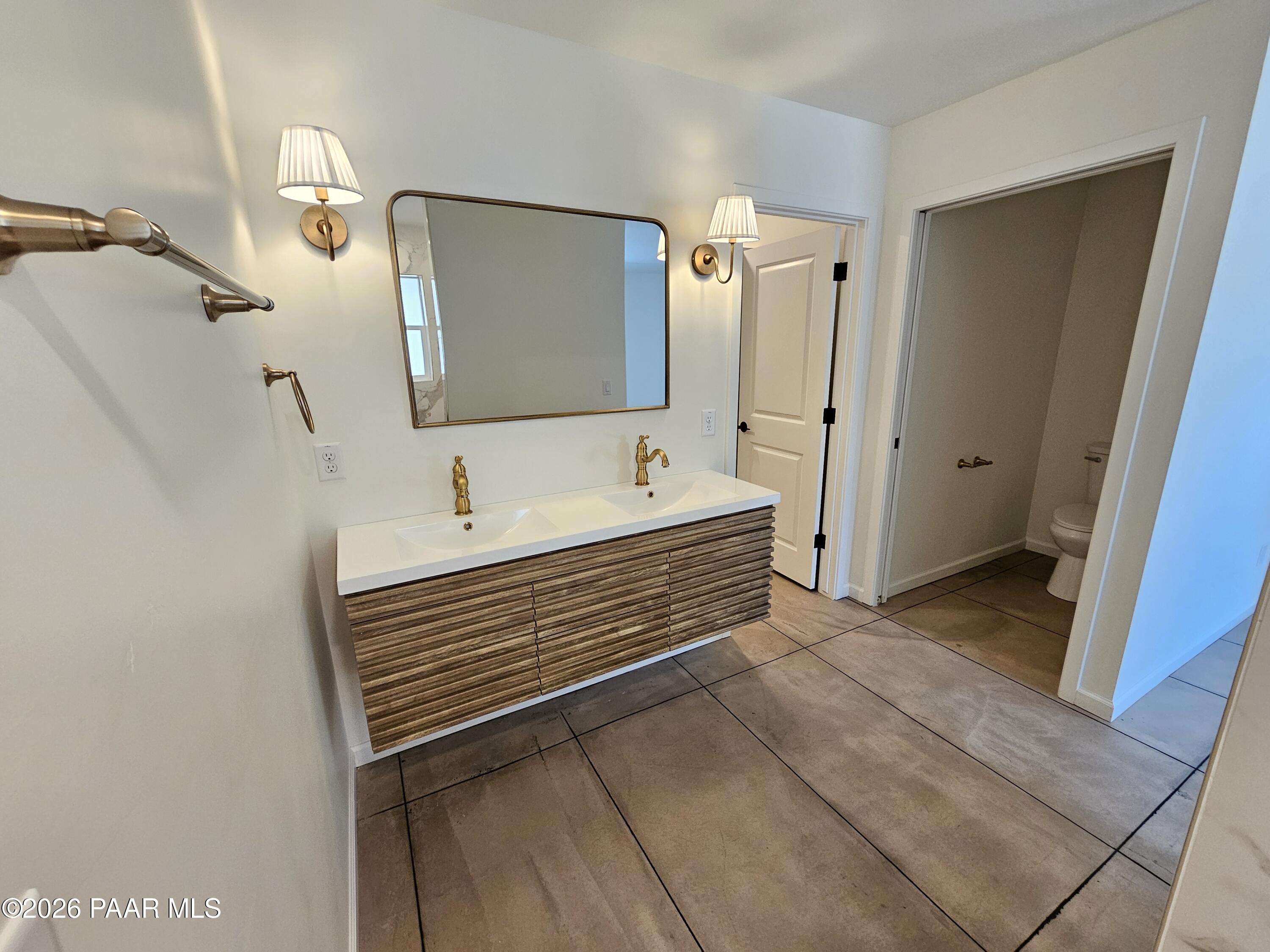 4920 East Amber Road Prescott, AZ 86301 - Photo 24 of 38 a bathroom with a sink and a mirror