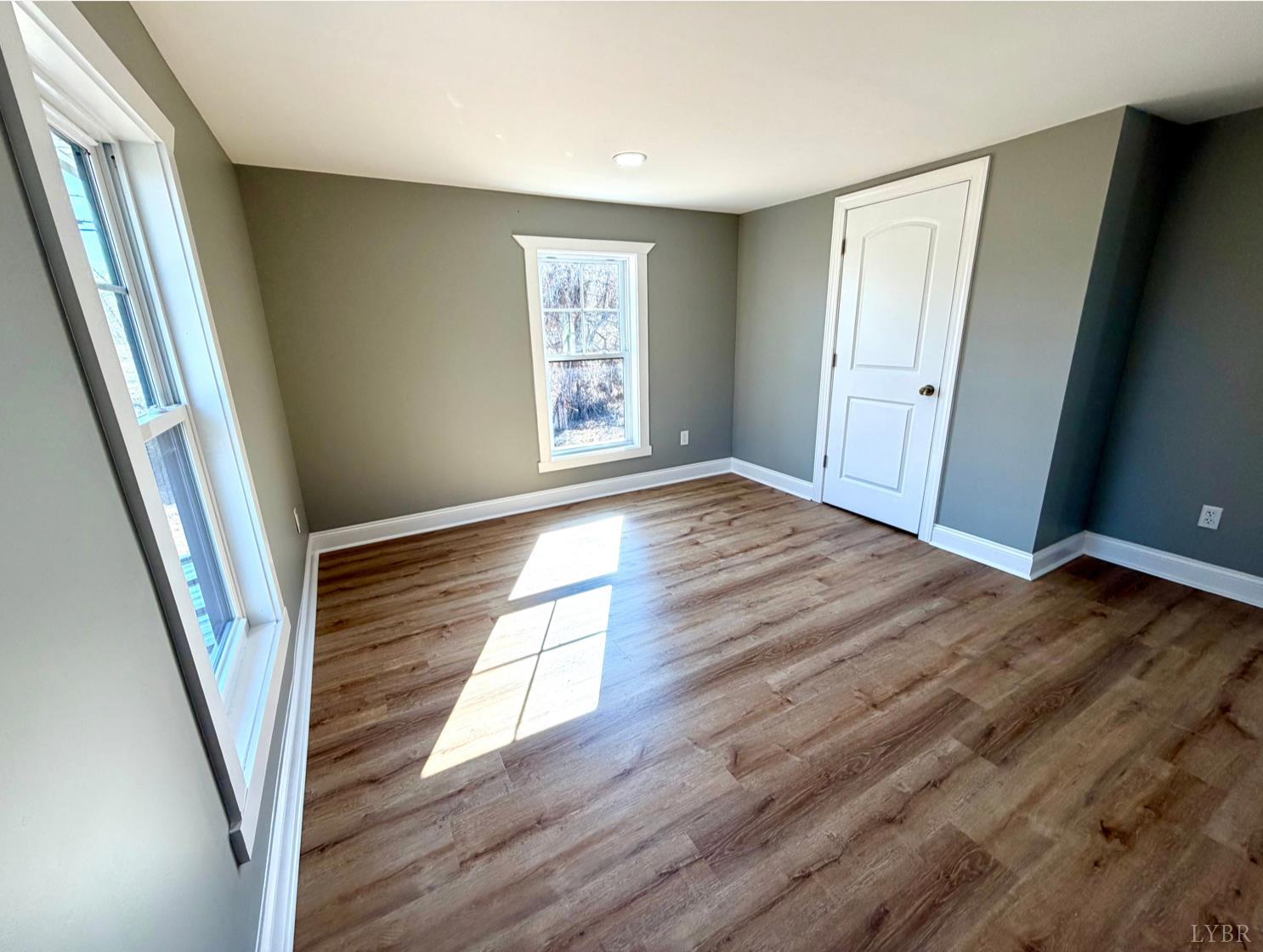 117 Monroe Street Monroe, VA 24574 - Photo 24 of 37 wooden floor in an empty room with a window