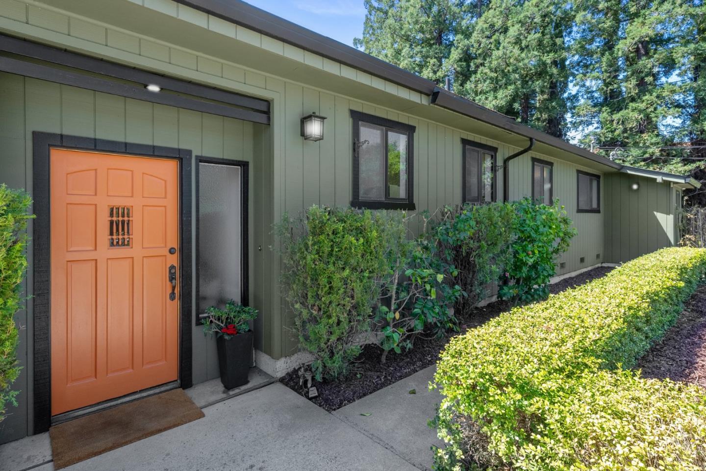 20540 Leonard Road Saratoga, CA 95070 - Photo 12 of 49 a front view of a house with garden