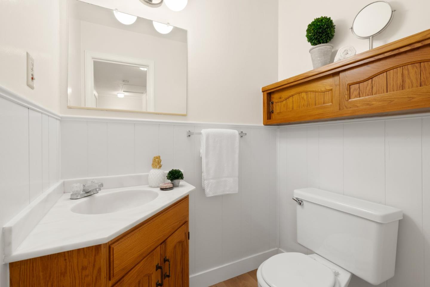 20540 Leonard Road Saratoga, CA 95070 - Photo 30 of 49 a bathroom with a sink toilet and mirror