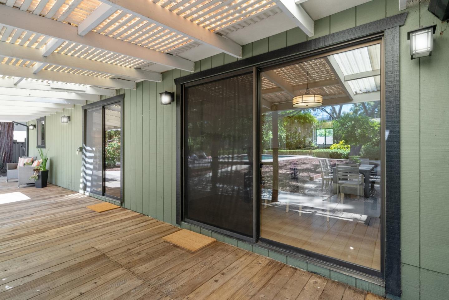 20540 Leonard Road Saratoga, CA 95070 - Photo 33 of 49 a bedroom with a bed and wooden floor