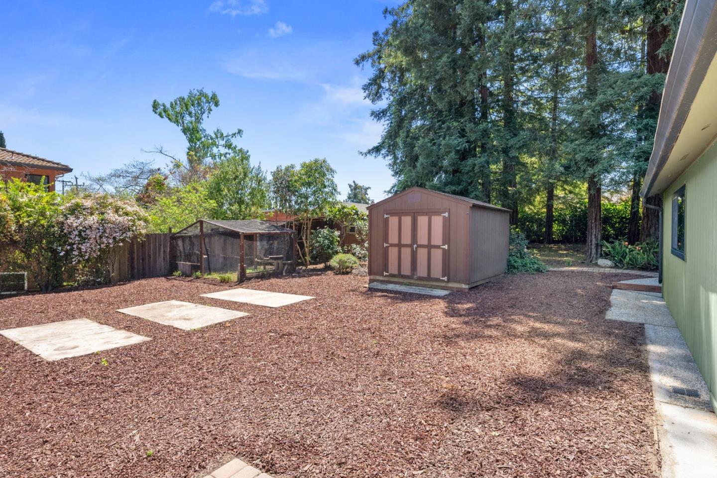 20540 Leonard Road Saratoga, CA 95070 - Photo 5 of 49 a backyard of a house with lots of green space