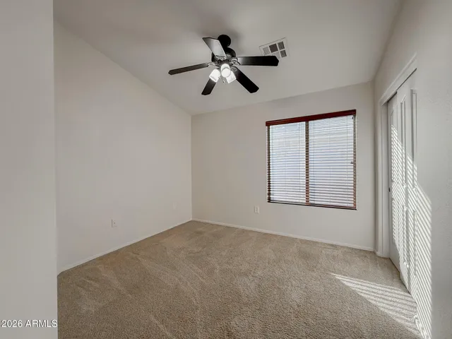 a view of empty room with windows
