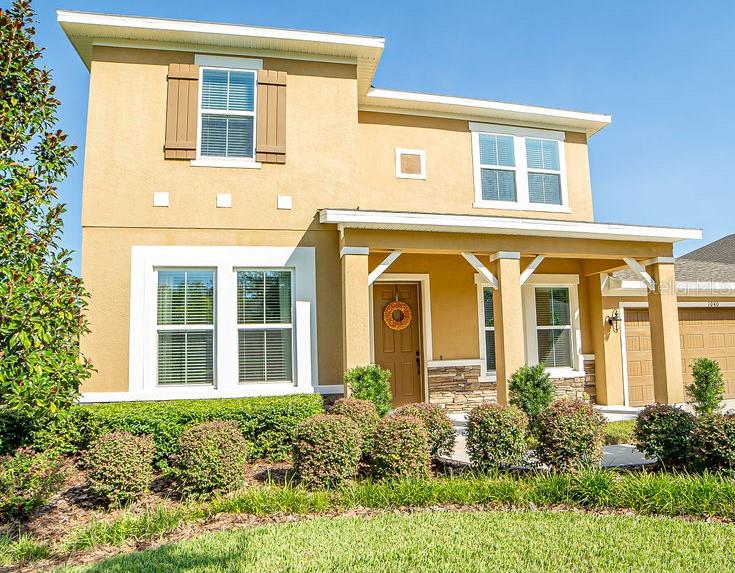 front view of a brick house with a large windows