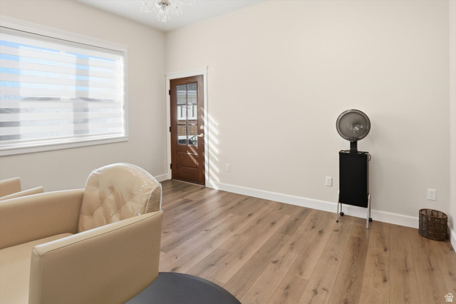 534 East Fish Hatchery Road Mantua, UT 84324 - Photo 39 of 87 Sitting room with wood finished floors and suspended lighting