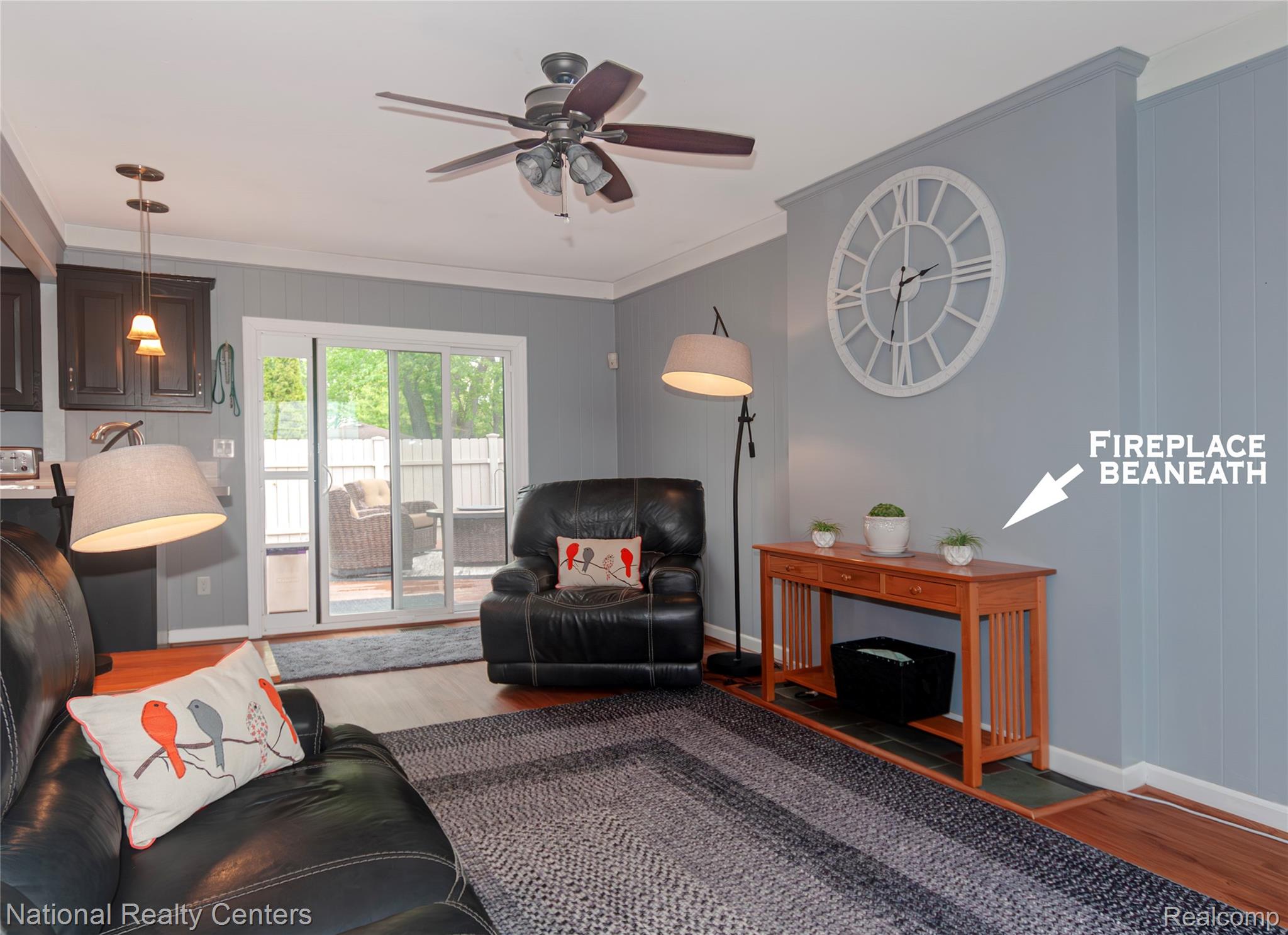 2446 Milverton Road Troy, MI 48083 - Photo 16 of 41 Living room featuring crown molding, wood finished floors, and a ceiling fan